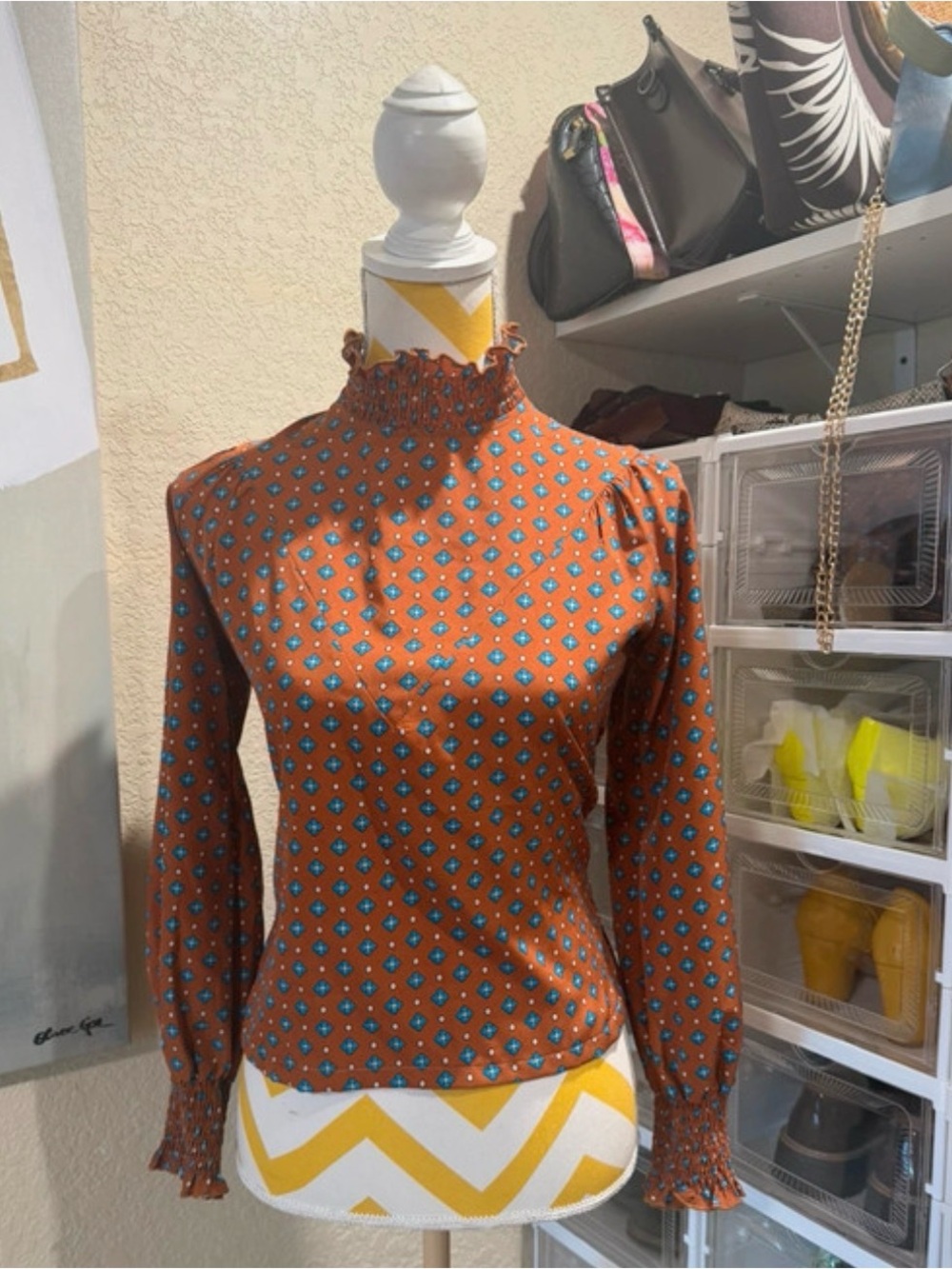 Women's Rust Long-Sleeve Smocked Neck Top with Teal Geo Print